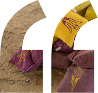 A pile of beanbags with the ASU fork logo on them